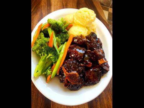 Oxtail is perfectly paired with mashed potatoes and steamed vegetables.