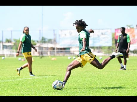 Jody Brown prepares to strike a ball during a Reggae Girlz training session at the Anthony Spaulding Sports Complex in Kingston on June 14.