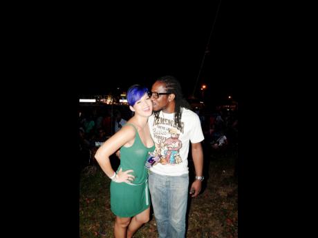 Tami Chynn (left) and husband Wayne Marshall shared a special moment as they supported Tessanne Chin during her performance at Reggae Sumfest in 2012.