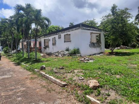 A developer is planning a multimillion-dollar development for this Oakridge Road property in St Andrew even as a family questions his claim to the lot registered to their deceased mother.