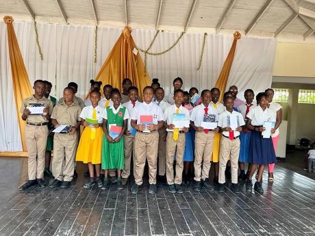 Twenty-seven students from seven schools in St Catherine, last Friday, received scholarships from the Poverty Alleviation and Empowerment Foundation amounting to $15,000 each, as they transition from primary to high school in September.