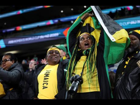 Jamaican fans celebrate after their team drew 0-0 during the Women’s World Cup Group F football match against France at Sydney Football Stadium in Sydney, Australia on Sunday.