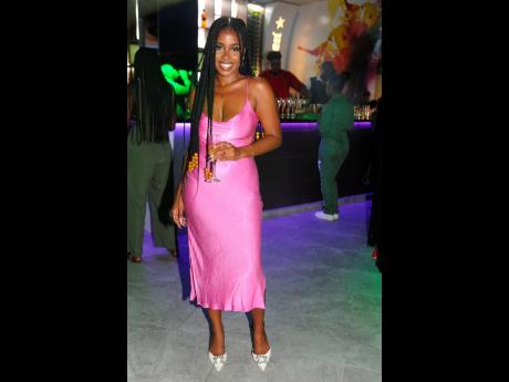 Pretty in pink, with summer braids to match, is Melissa Dacres-Jones, digital media and communications consultant. 