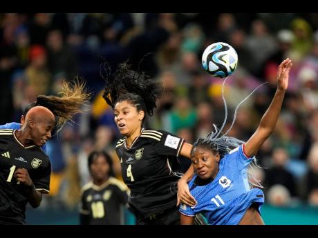 Jamaica’s Deneisha Blackwood (left) heads the ball next to teammate Chantelle Swaby (centre) and France’s Kadidiatou Diani during a Women’s World Cup Group F match at the Sydney Football Stadium in Sydney, Australia on Sunday, July 23. The match ende