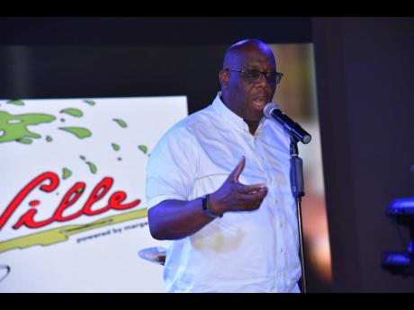Howard McIntosh, chairman of the Entertainment Advisory Council, addressing guests at the launch International Dancehall Queen Competition at Coral Cliff in Montego Bay. 