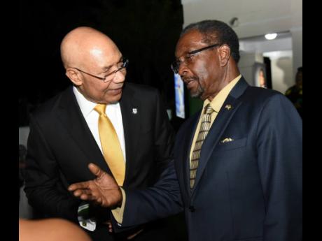 Governor General Sir Patrick Allen (left) shares a moment with Nick Perry, United States ambassador to Jamaica, during the Governor General’s Independence Reception at King’s House in St Andrew on Thursday night.