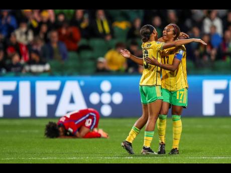 Jamaica’s Allyson Swaby (right) and Tiernny Wiltshire celebrate at the end of the Women’s World Cup Group F football match against Panama in Perth, Australia yesterday.