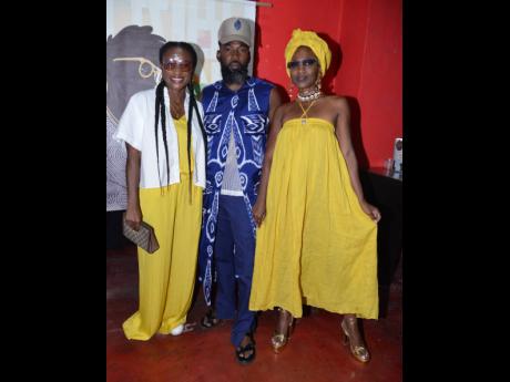 Flanked by sunshine, Tribe Nine Boss Troy-Oraine Williamson poses with fellow creatives Carleene Samuels and Tamo Ennis (right). 