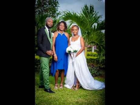 Colin and Celina are joined by the mother of the bride, Hyacinth Robinson (centre), who walked Celina down the aisle in her father’s absence.