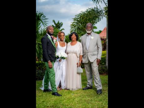 Happy to show their support for Colin and Celina are parents of the groom, Pauline and Vernal Phillips (right).
