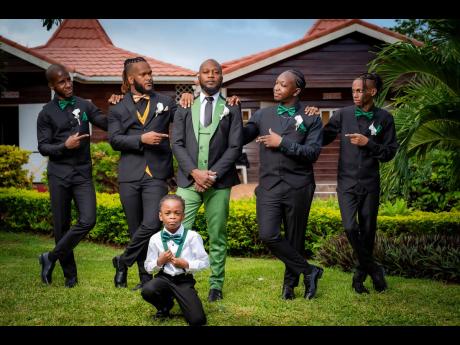 Standing with the groom on one of the most important days of his life are (from left) groomsman Tyrone Gordon, best man Vernal Phillips, and groomsmen Kevaughn Davis and Donai Dixon, along with the ring boy, Sidan James.