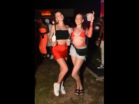  Alice Hemmington (left) and Megan Horrocks strike a pose at Dream Weekend’s Celebrity Playground on Friday at Wavz Beach in Negril.