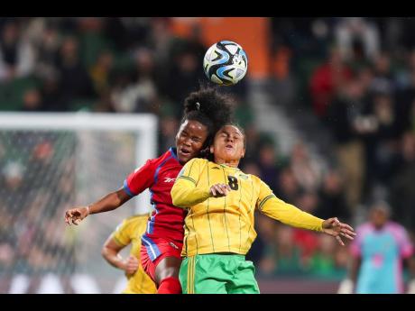 Jamaica’s Drew Spence (right) goes for a header with Panama’s Deysire Salazar during the 2023 Women’s World Cup Group F  match between Panama and Jamaica in Perth, Australia on Saturday, July 29. Jamaica won 1-0.