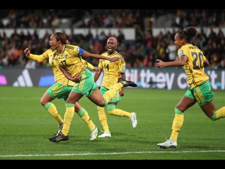 Jamaica’s Allyson Swaby (left) celebrates with teammates after scoring the opening goal during the Women’s World Cup Group F soccer match between Panama and Jamaica in Perth, Australia, on Saturday, July 29. Jamaica won 1-0.