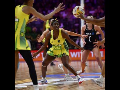Sunshine Girls wing attack Khadija Williams (centre) is a picture of concentration during a Netball World Cup third-place playoff game against New Zealand at the Cape Town International Convention Centre in in Cap Town, South Africa earlier today.