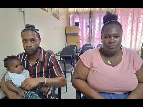 Donald Lewis and Tareena James with their seven-month-old son, Theodore Lewis, who has been diagnosed with Erb’s palsy, following nerve damage to his right arm reportedly sustained during his birth at the Falmouth Public Hospital on January 20.