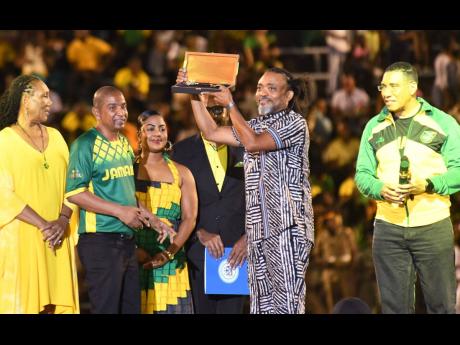 Trinidadian soca sensation Machel Montano (second right) accepts the Key to the City of Kingston from Mayor Delroy Williams (second left) as Prime Minister Andrew Holness (right) and other officials look on. Also pictured are Payne Land Division Councillor