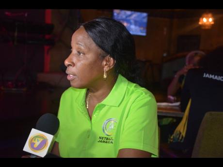 Sunshine Girls coach, Connie Francis, being interviewed by journalists at the Coral Cliff in Montego Bay yesterday. 