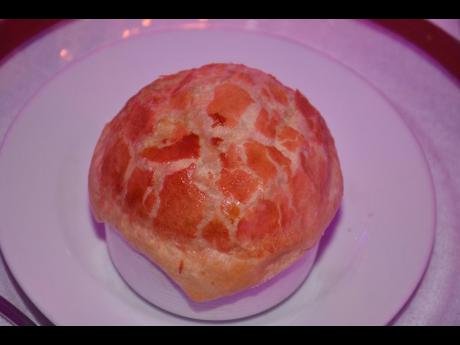 Chef Allaine Murray’s pepper pot soup finished with coconut cream and ginger in a flaky pastry dome. 
