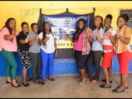 Principal of the St Catherine-based Garden Hill Primary and Infant School, Shakira Hudson (left), and teachers celebrate the school’s success in the Primary Exit Profile exam, where over 80 per cent of students were placed at their high school of choice.