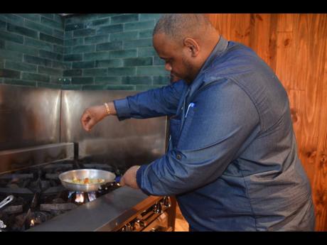 Executive chef Dwayne Bell preparing an Ital stew for The Gleaner team.