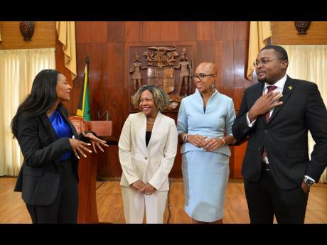 Managing Director, HEART/NSTA Trust, Dr Taneisha Ingleton (left), converses with (from second left) Minister without portfolio in the Office of the Prime Minister with oversight for Skills and Digital Transformation, Senator Dr Dana Morris Dixon; Minister 