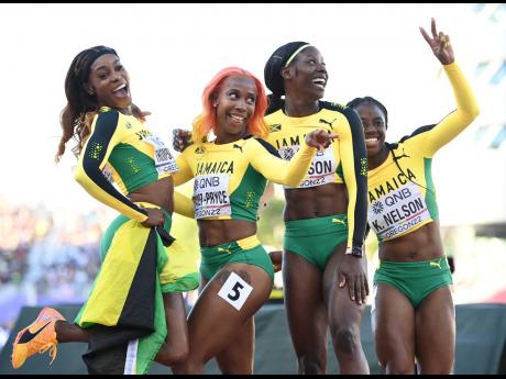 From left: Elaine Thompson Herah, Shelly-Ann Fraser-Pryce, Shericka Jackson, and Kemba Nelson celebrate after finishing second in the women’s 4x100 metres at the World Athletics Championships inside Hayward Field in Eugene, Oregon, last year.