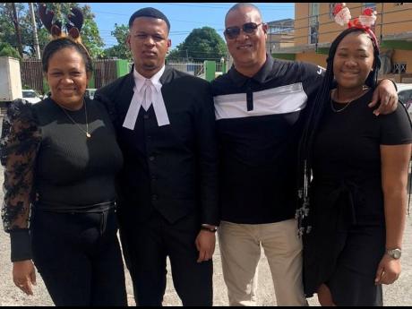Ackeliah Hemmings (right) poses with (from left) mother Natalie Thompson; her older brother and attorney-at-law Akheme Harris; and Kevin Whitter, her father figure.
