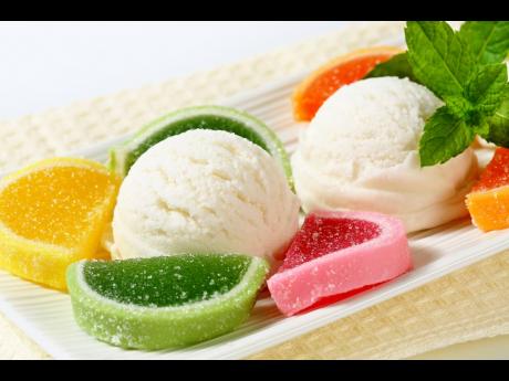 Scoops of white ice cream garnished with jelly candy.