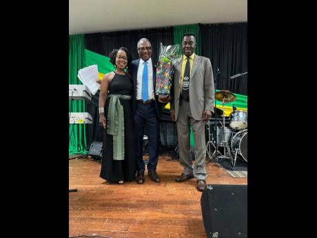 From left: Arlene Amitirigala, Justice Aston J. Hall, and Dr Sylvanus Thompson, recipient of the Community Service Award – individual.