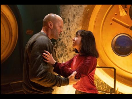 Jason Statham (left) and Shuya Sophia Cai in a scene from ‘Meg 2: The Trench’.