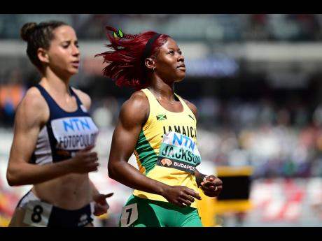 Gladstone Taylor/Multimedia Photo Editor
Shericka Jackson of Jamaica (right) competes in heat 4 of the womens 100m round 1 at the morning session of the 2023 World Athletics Champion held at the National Athletics Centre in Budapest, Hungary yesterday. Jac