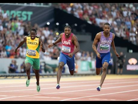 Jamaica’s Oblique Seville (left) narrowly misses out on a podium position in yesterday’s men’s 100 metres final at the 2023 World Athletics Championships in Budapest, Hungary.  Seville placed a close fourth behind Zharnel Hughes (right) of Great Brit