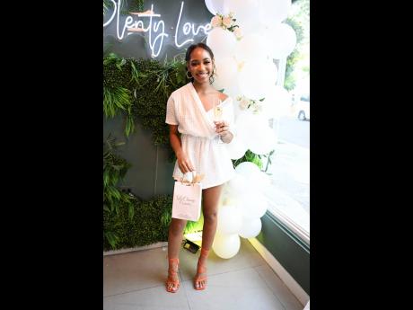 Legally a babe, Kelli-Ann Younger gives a pop of colour with these orange strappy sandals. 