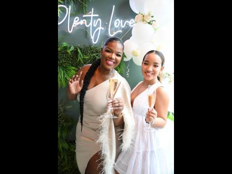 Boss babes Shanique Ellington (left), owner of Le Champ Cosmetics, and Café Catch Up founder Justine Isaacs take a break from beauty and creative domination to snap a quick pic.