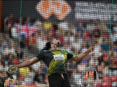 Jamaica's Fedrick Dacres in the middle of throwing discus during that event's final at the World Athletics Championships inside the National Athletics Centre in Budapest, Hungary. 
