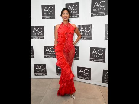 Hema Luxe’s Emma Subratie wore a red feather gown from 2020 Collections.