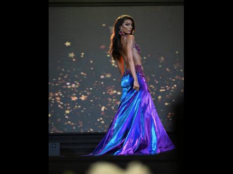 Miss Universe Jamaica 2023 Dr Jordanne Lauren Levy wears an iridescent blue-and-purple gown by Dermoth Williams Couture.