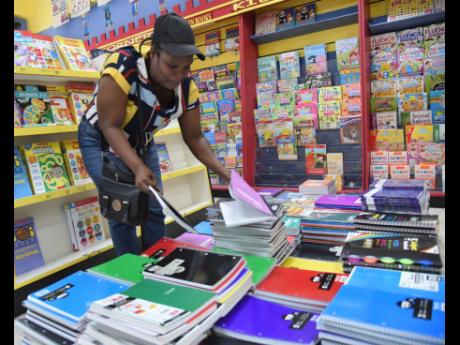 A parent shopping for books inside Kingston Bookshop’s Springs Plaza store in Half-Way Tree, St Andrew, on Tuesday.