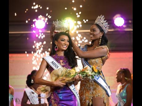 Dr Levy is crowned by Miss Universe Jamaica 2022 Toshami Calvin. 