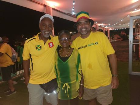 From left: Drs Emerson Henry, Juliet Smith-Edwards, and Winston De La Haye, who all studied in Budapest, Hungary, are among the fans in the European country cheering for athletes from their island nation. 