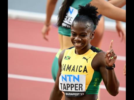 Jamaica’s Megan Tapper is all smiles after successfully negotiating her first-round World Athletics Championships heat on Tuesday.
