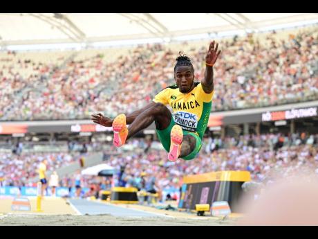 Jamaica’s Wayne Pinnock leaps out to a world-leading 8.54 metres during long jump qualification at the World Athletics Championships in Budapest, Hungary, yesterday. 