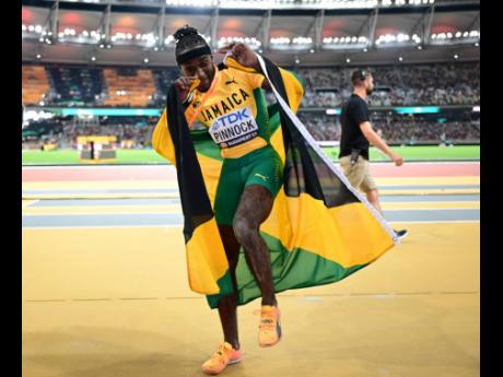 Jamaica’s Wayne Pinnock dances to celebrate his silver medal in the men’s long jump final at the World Championships in Budapest, Hungary, today.