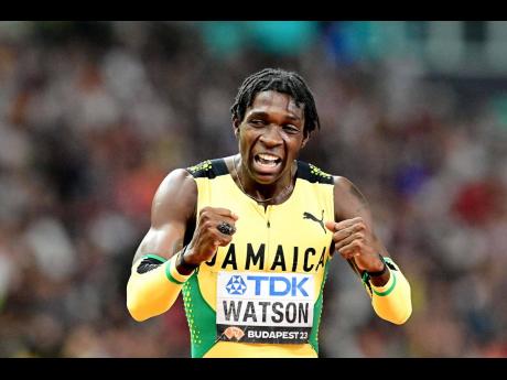 Jamaica’s Antonio Watson celebrates winning the men’s 400 metres final at the 2023 World Athletics Championships at the National Athletics Centre in Budapest, Hungary, yesterday. Watson won the gold medal with a time of 44.22 seconds.
