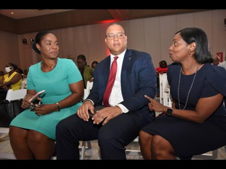Dr Tameka Benjamin (left), national mathematics coordinator in the Ministry of Education and Youth, and Perrin Gayle (centre), head of retail for Scotiabank’s Caribbean North and Central Region, in dialogue with Yanique Forbes-Patrick, vice-president, pu