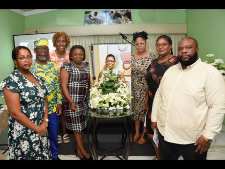 Daughter of the late media manager and journalist, Beverley Sinclair, Channtal Golding-Wiles (left), poses with staff members at the Jamaica Information Service (JIS) where her mother had a brief stint as Editorial and Photography Manager. The occasion was