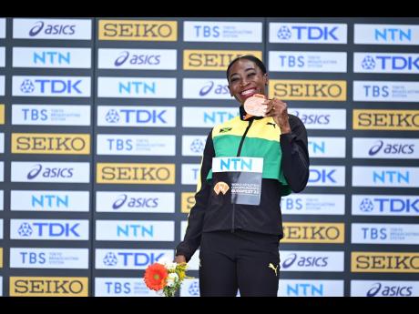 Bronze medallist in the women’s 400m hurdles Rushell Clayton at her medal ceremony.