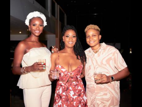Smile and toast! These three beauties (from left) Janelle Russell, executive assistant to EBONY’s CEO Michele Ghee; Ramona Riley, owner of Cosmic Womban; and artist Gabrielle Murdock, share the frame.