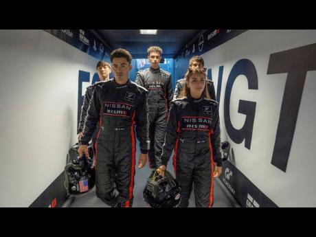 From left, Sang Heon Lee, Darren Barnet, Archie Madekwe, Emelia Hartford and Pepe Barroso Silva  in a scene from ‘Gran Turismo’. 